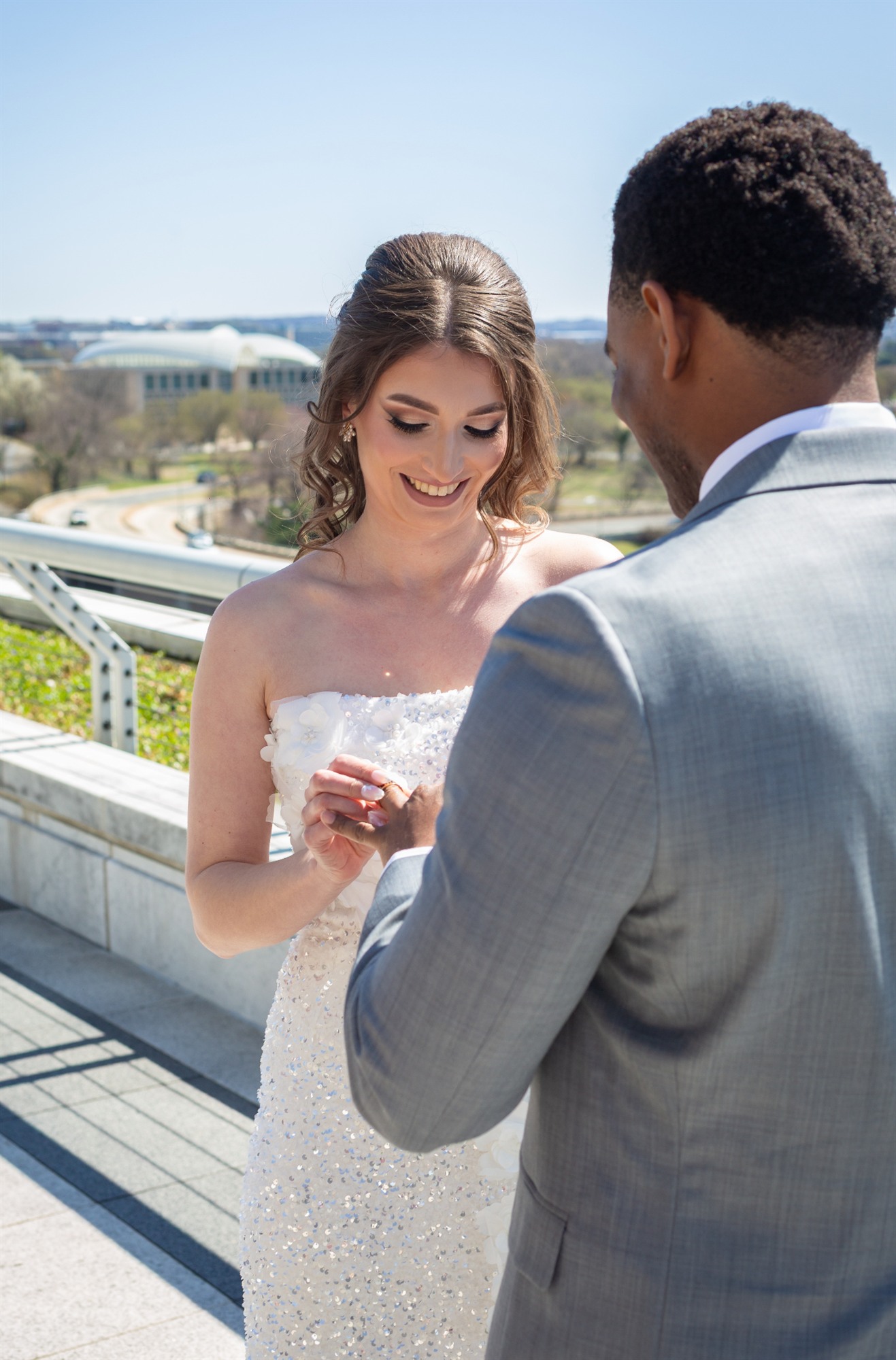 Bride and groom sharing a first-look moment on a rooftop