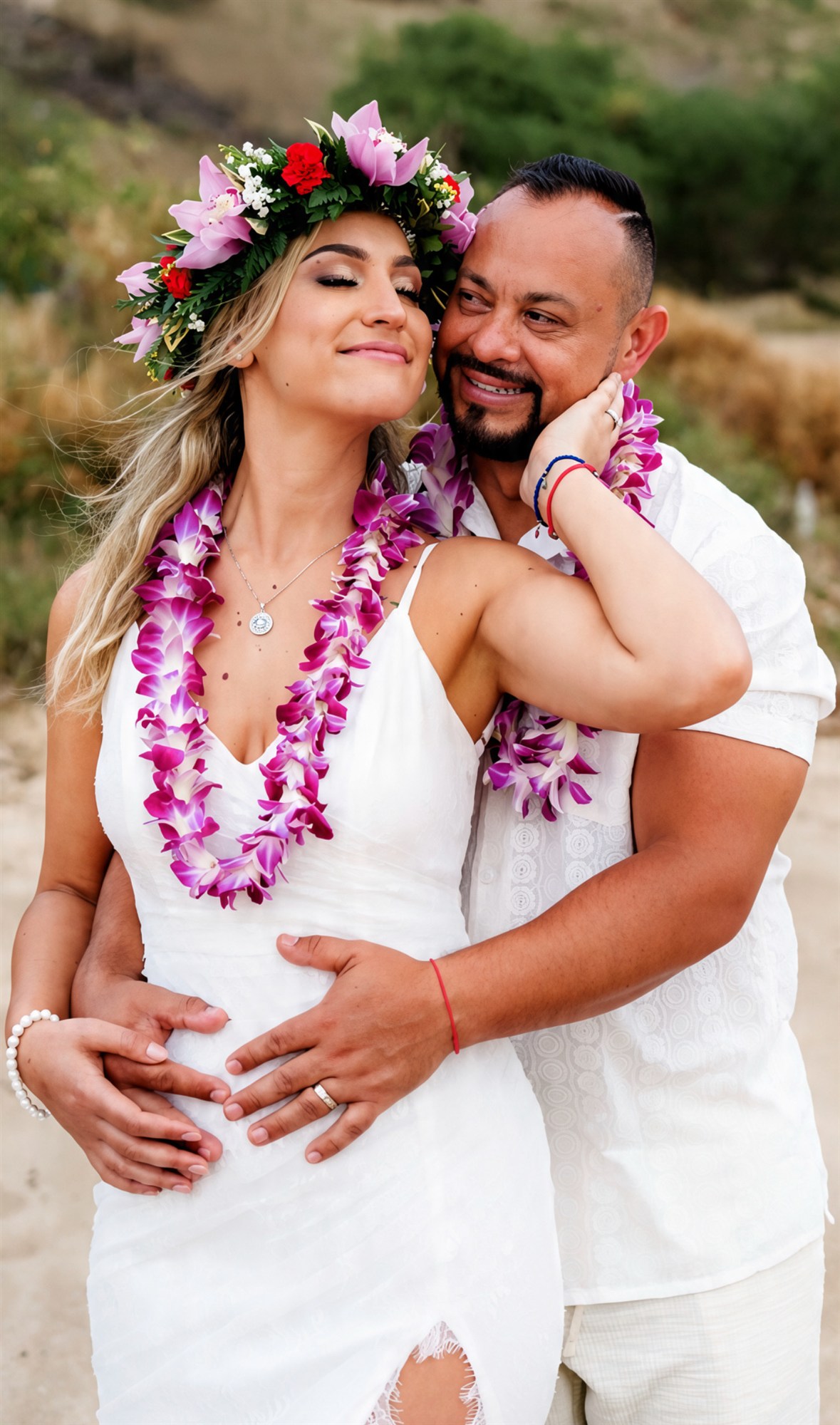 Bride and groom sharing a quiet moment on the beach, flower crown