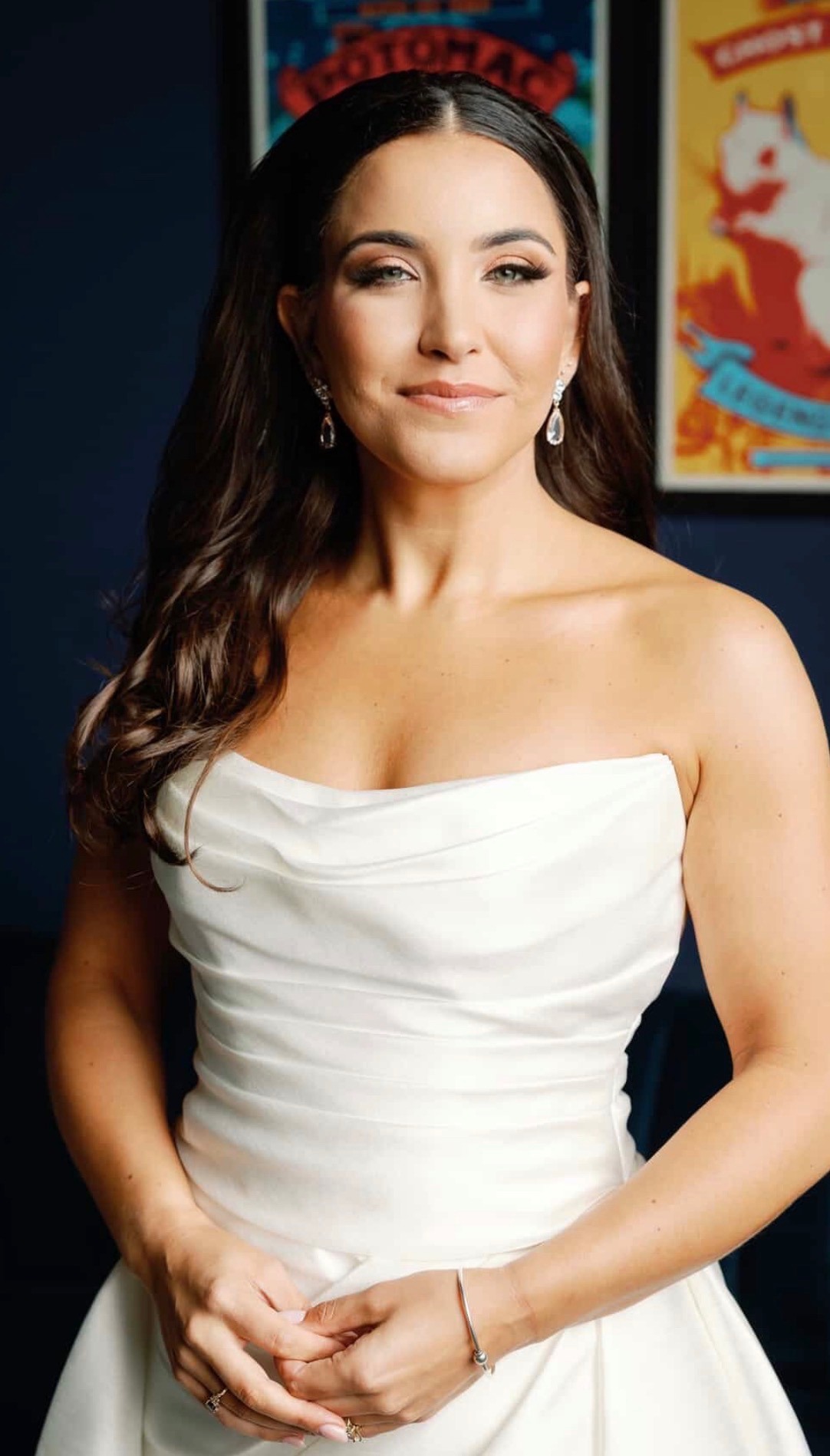 Close-up of finished bridal makeup, eyes closed, soft smile