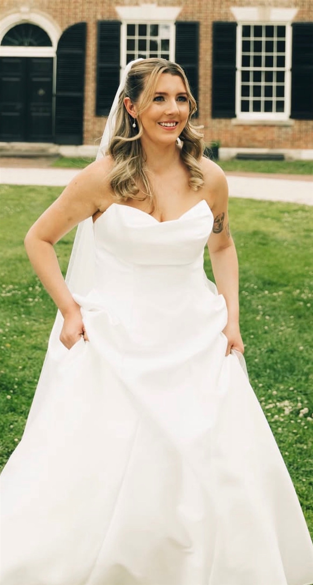 Close-up of finished bridal makeup, front-facing portrait, lace robe