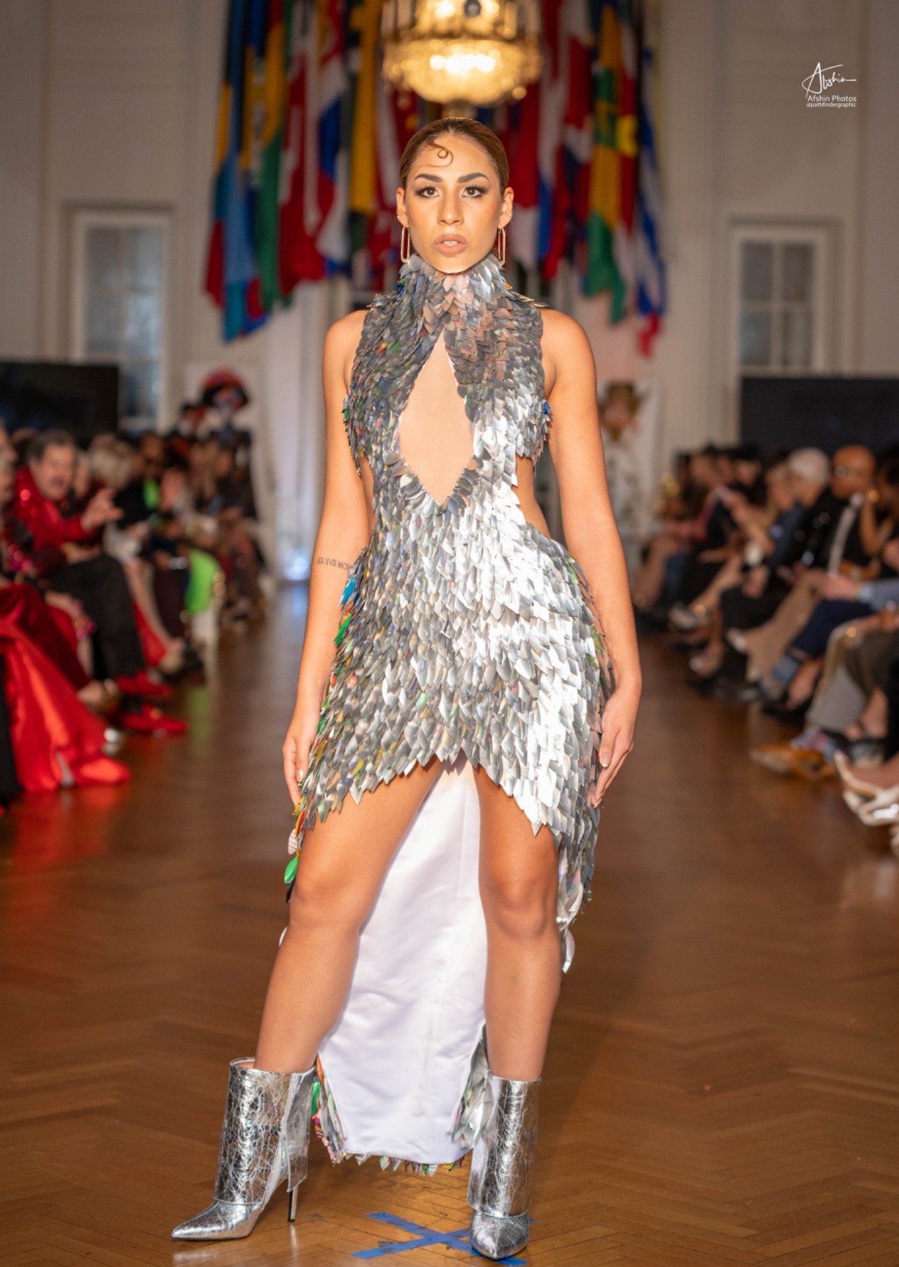 Model on the runway in an avant-garde silver look