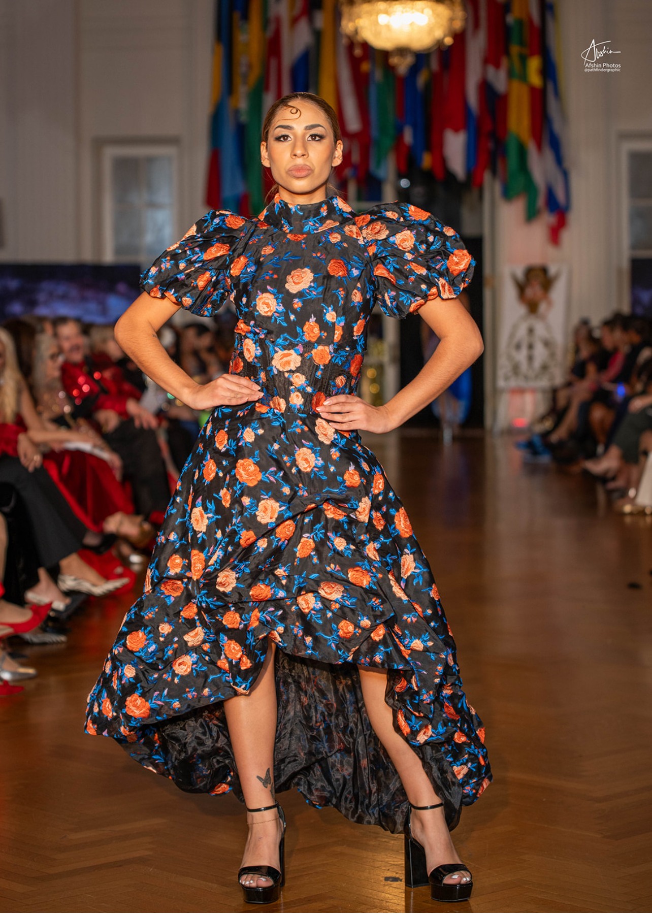 Model on the runway in a floral puff-sleeve dress
