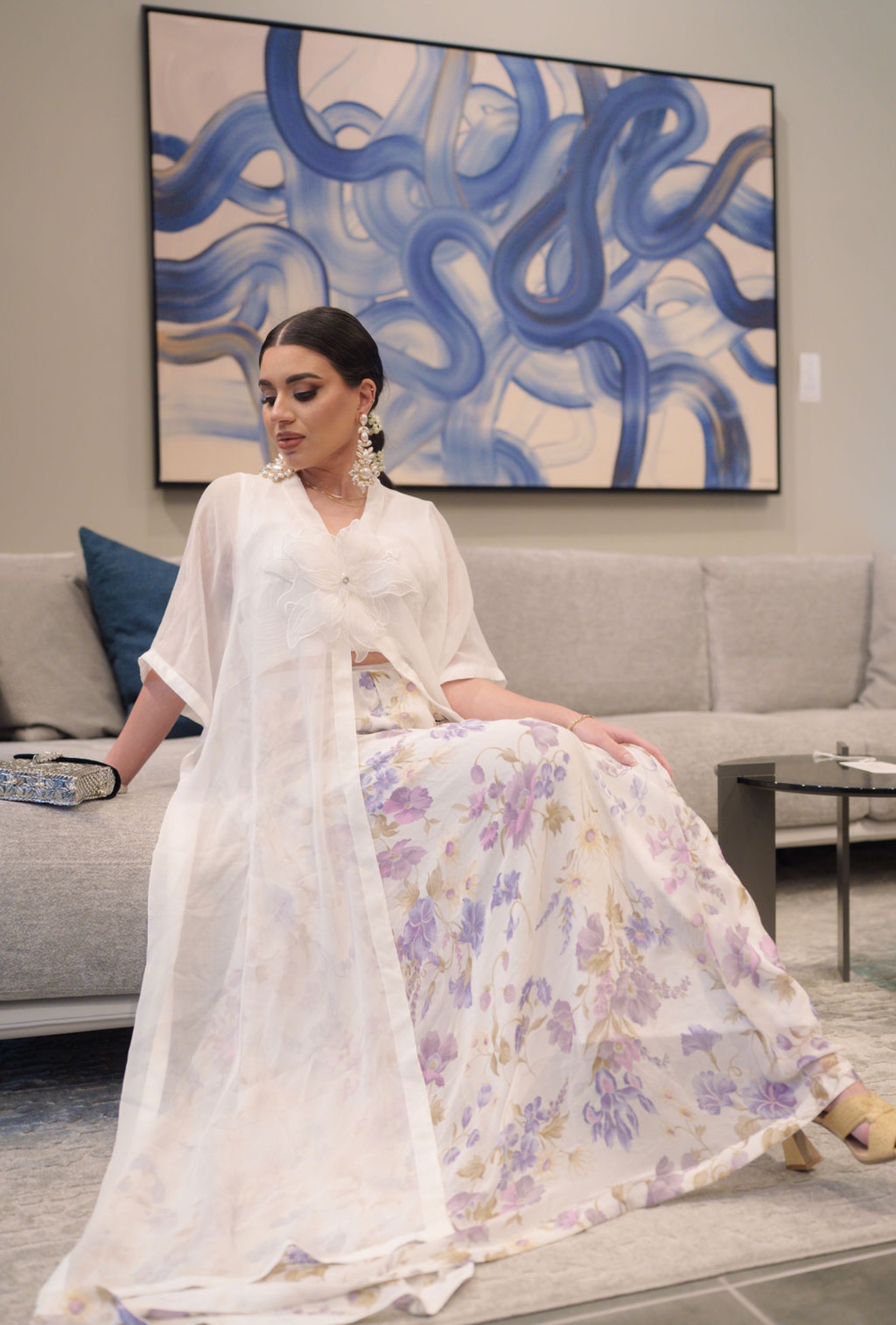 Model in a white floral kaftan, editorial styling